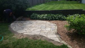 Natural stone patio to sit on and enjoy within a native landscape surrounded by native plants